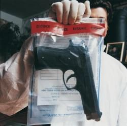 Man Holding A Plastic With Gun